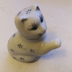 Child's teapot in blue and white ceramic.